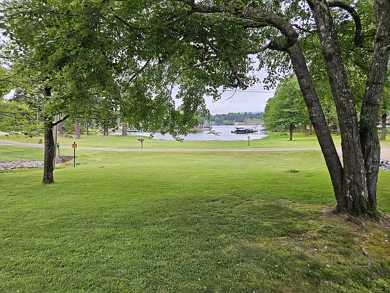 View from front porch to Lake Hamilton access and boat dock on the left side of the cove.