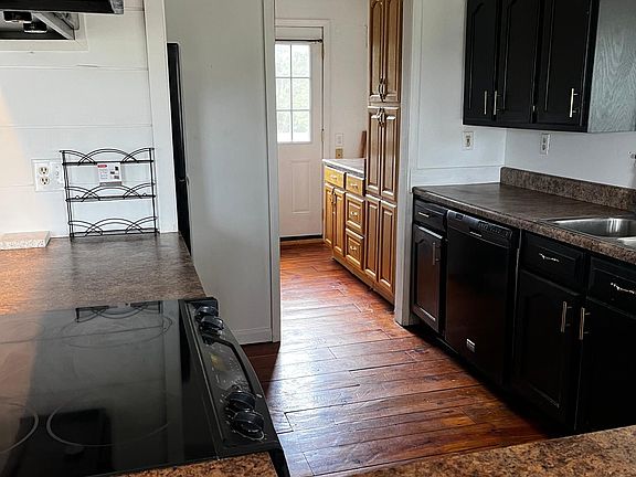 Cooktop in island and pantry storage
