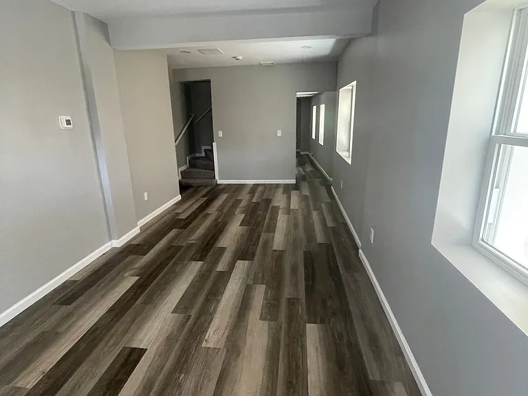 Living room, Some photos are mirror opposite from 201 W High St both finished the same inside.
