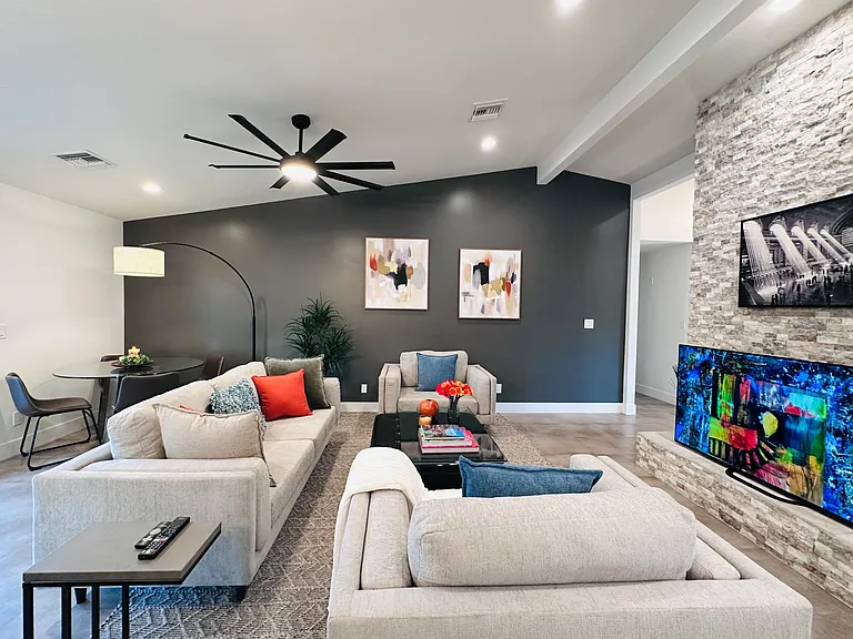 Open-Concept Living area:
Vaulted high ceilings, abundant natural light, fan, TV ...