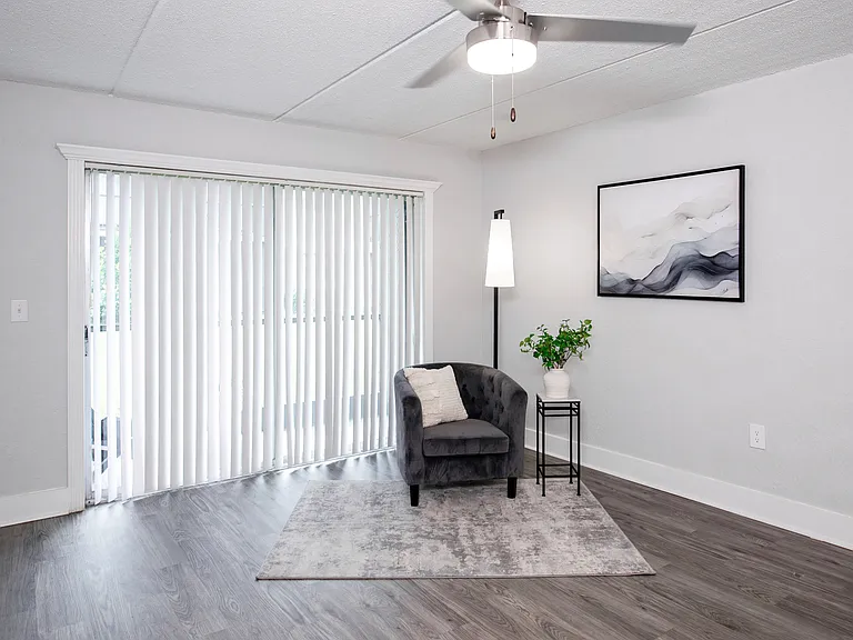 This bright and open living room offers direct access to your private screened patio, perfect for enjoying some fresh air.
