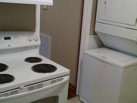 Kitchen with stacked washer/dryer