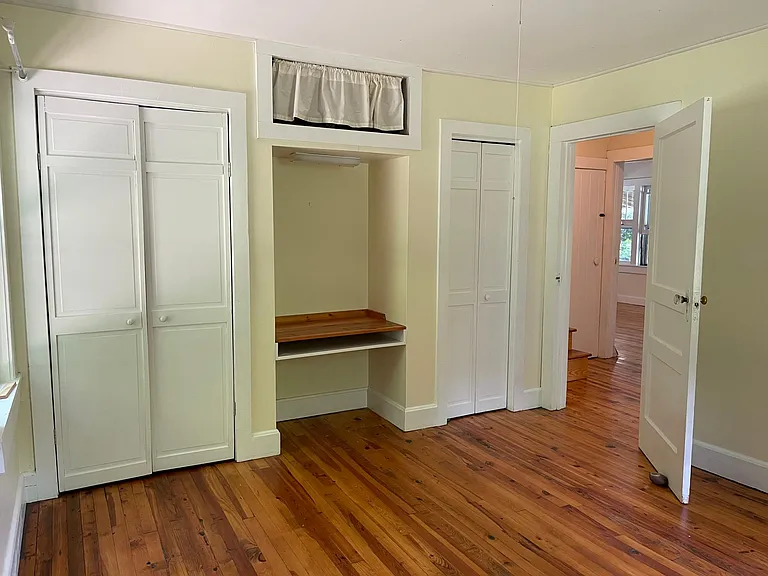 Bedroom 1: Larger downstairs bedroom has built ins and plenty of closet space.