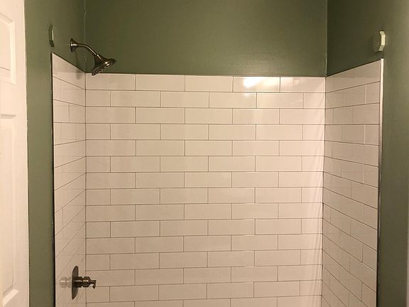Brand new tub, tile, toilet, vanity, amd fixtures.