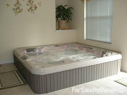SPA ROOM WITH RECESSED HOT TUB
						:
						Enclosed spa room adjoining the Master BR has ceramic tile floor, patio access.