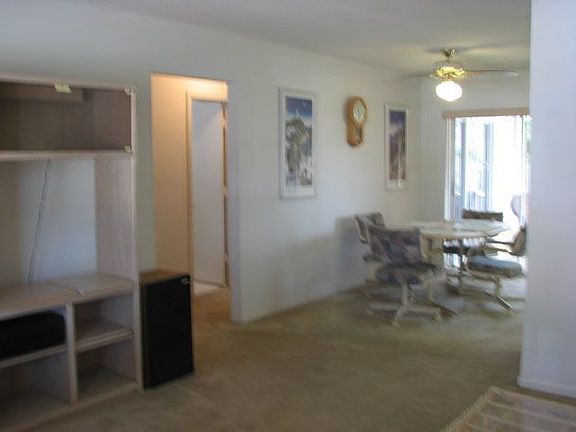 Living/dining room with sliders to patio 