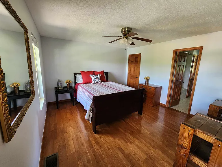 First floor bedroom, with queen bed and attached full bathroom