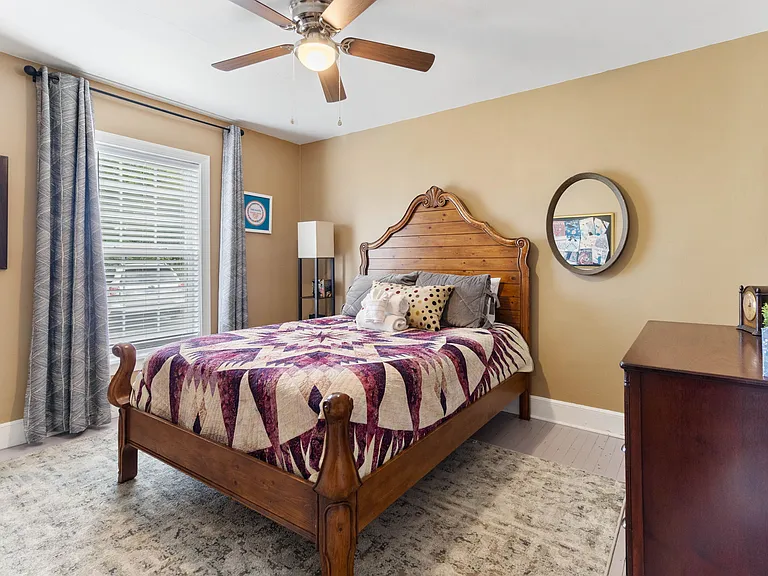 Logan's Room at Hunsucker's Place features a cozy memory foam bed, tasteful decor, and natural light. Located near Downtown Greensboro and Cone Health Hospital, this inviting space offers comfort and convenience in a charming, centrally located home.