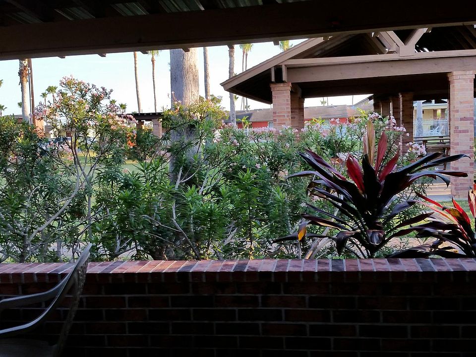 Faces open space,pool in distance.quiet(more private)