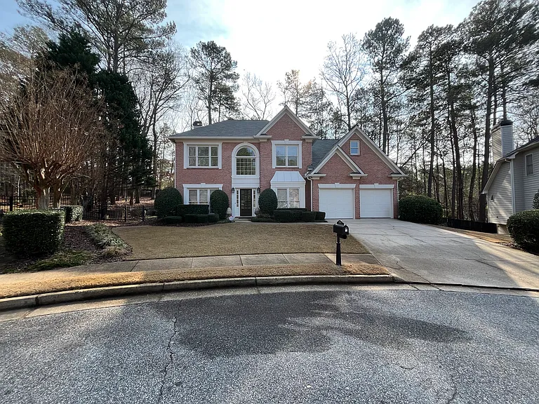 Front of Home on large cul-de-sac wooded private lot.