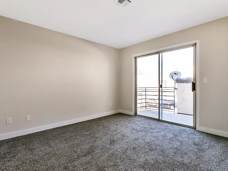 # Guardian Realty 6250 W Flamingo Rd Apt 55 Las Vegas Condo Rental master bedroom with balconey_02062020