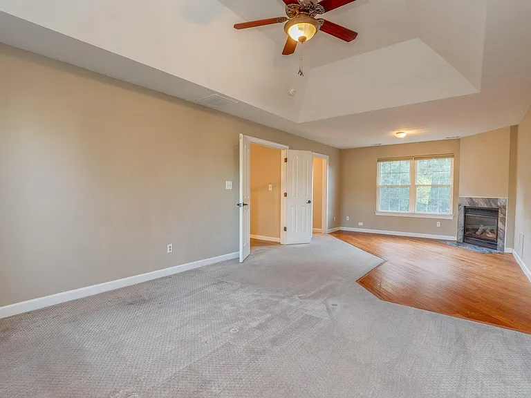 Primary en-suite with private fireplace and Tray/vaulted Ceiling