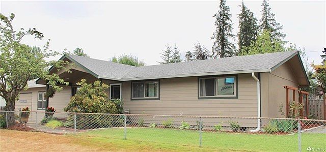 Attractive rambler on corner lot is fully fenced and beautifully landscaped.