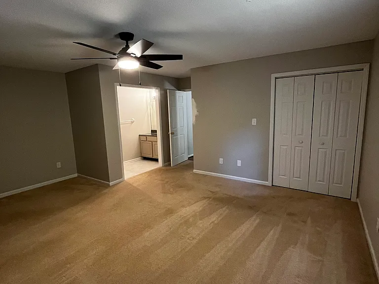 master bedroom with an en suite full bathroom