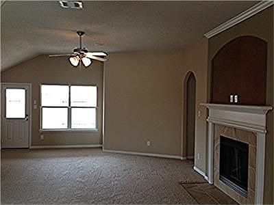 Family room with cozy fireplace.