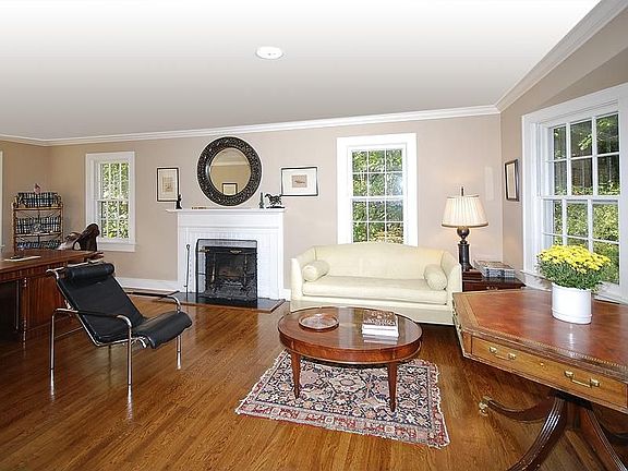 Large Living Room has a beautiful center
        fireplace