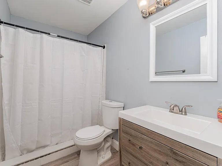 This bathroom is complete with a standing shower.