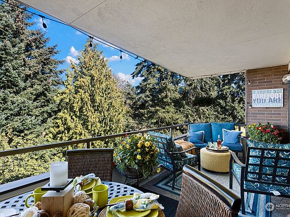 Additionally, this unit is at the end of the building surrounded by trees. This creates a level of privacy within the unit that few others enjoy. Go ahead and leave the curtains open!>