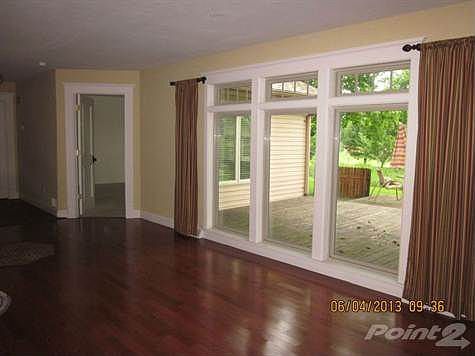 Great Room Windows look to back yard and deck