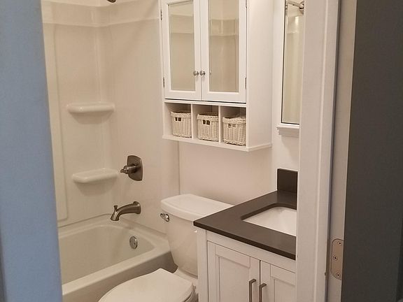 Lots of storage space with medicine cabinet, over the toilet cabinet, and vanity