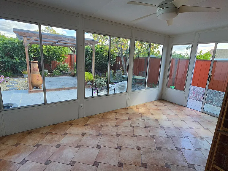 good size sun room with screen windows to let the breeze in and keep bugs out... an extension of living spaces