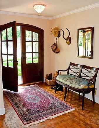 Foyer with custom mahogany door with beveled glass