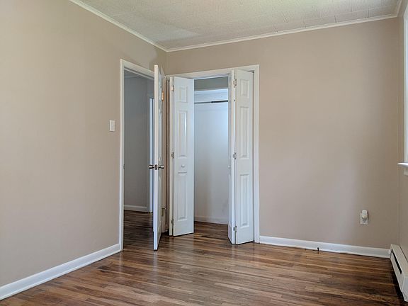 Upstairs bedroom with reach-in closet.