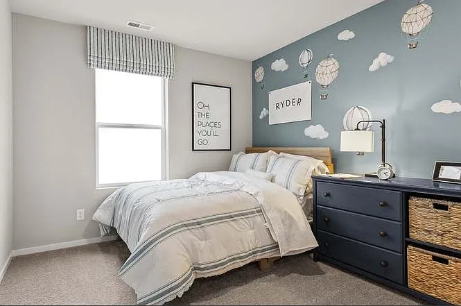 4th bedroom with window and side yard view.