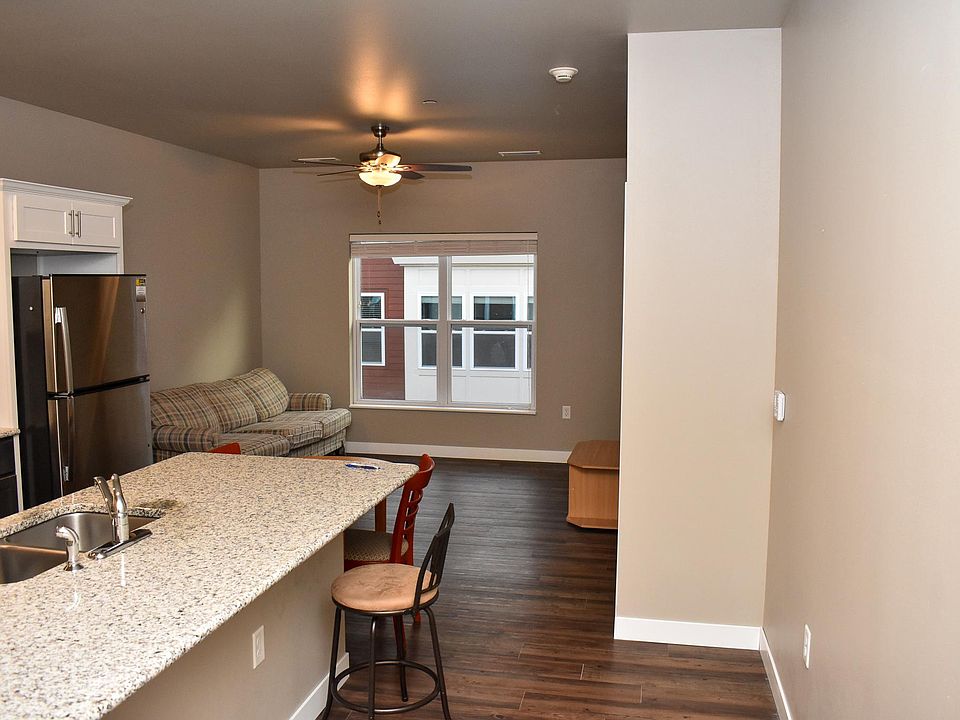 Kitchen in foreground and living room in background