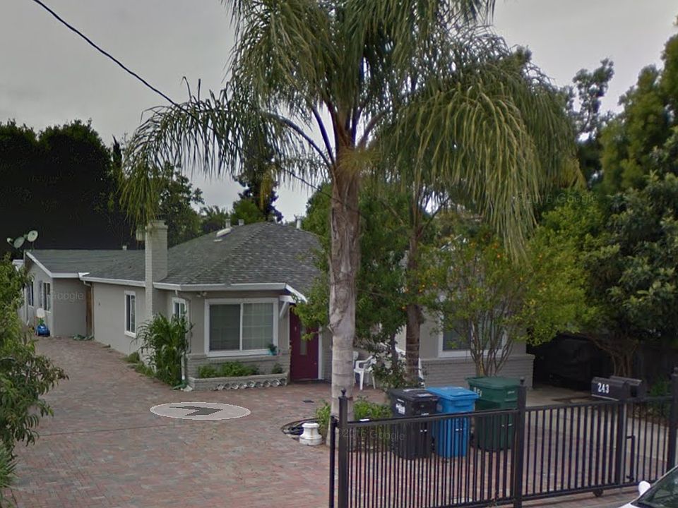 Entrance with gate, rental is back house