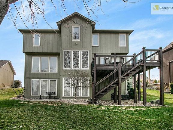 Full walkout lower level with an abundance of windows.  Room on the right for 5th bedroom or office.