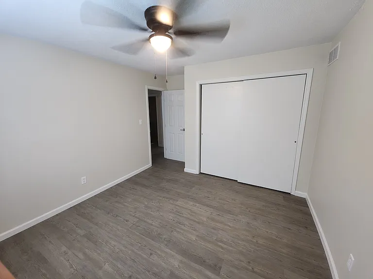 3rd Bedroom - new ceiling fan (view of doorway and closet)
