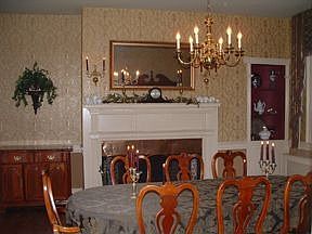 Enjoy a delightful meal in front of the fireplace in the regal dining room.