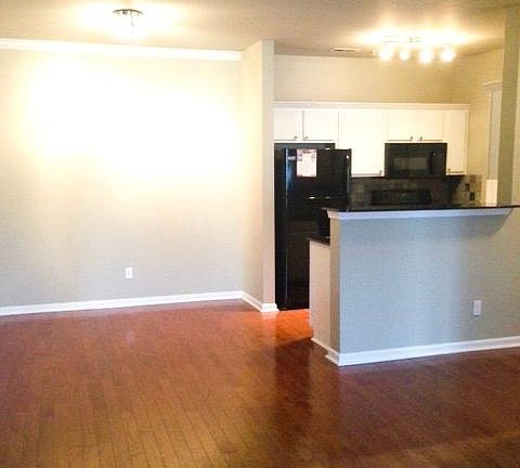 Gorgeous wood flooring, and modern fixtures