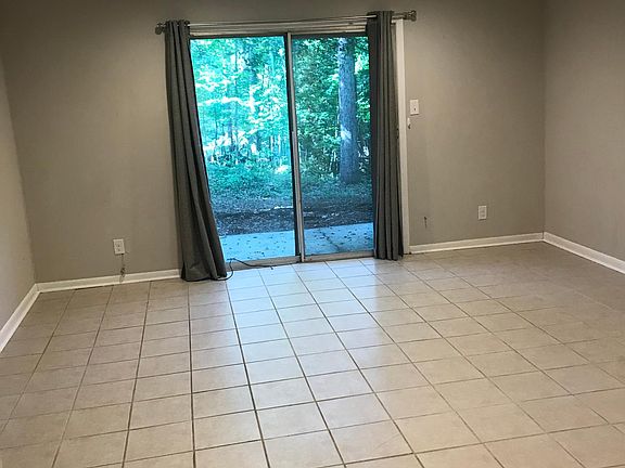 Living and Dining area with walk out to private rear patio and backyard. Plenty of room to garden or grill. View from the kitchen.