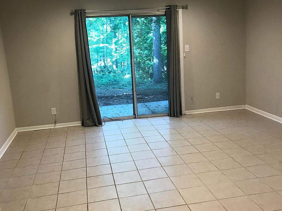 Living and Dining area with walk out to private rear patio and backyard. Plenty of room to garden or grill. View from the kitchen.