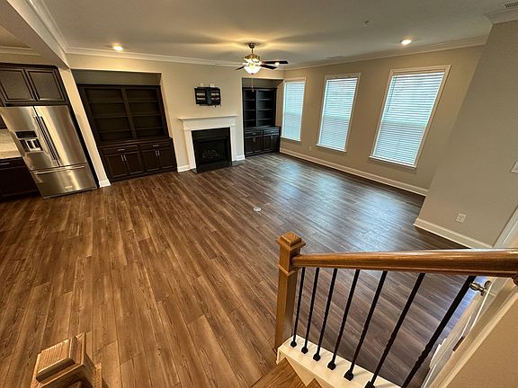living room, built-in bookshelves, gas fireplace with light switch