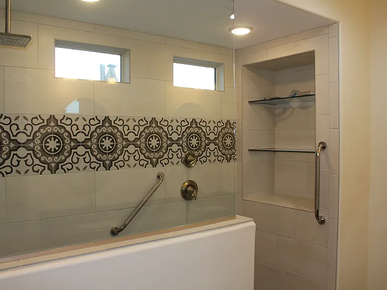 Upgraded walk-in shower with designer tile