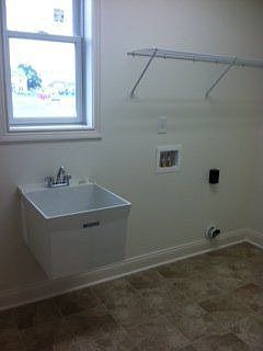 Laundry room with tile floor