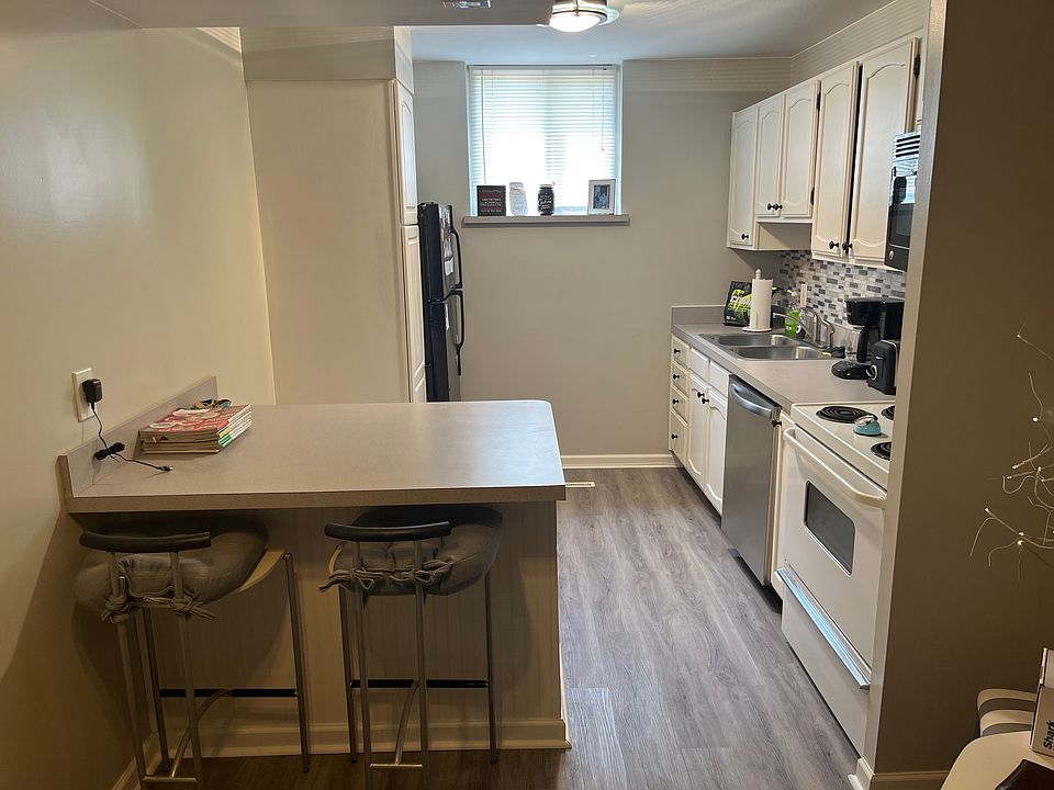 Kitchen island plus additional area with room for a table. 
Updated/refreshed kitchen in 2020. Cosmetic upgrades, painted cabinets, new backsplash, new lighting, new paint, new flooring.