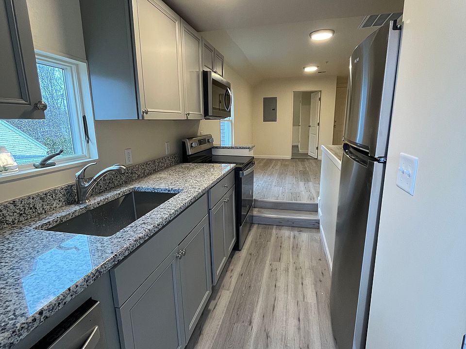 Newly renovated kitchen with brand new stainless steel appliances and new granite counters