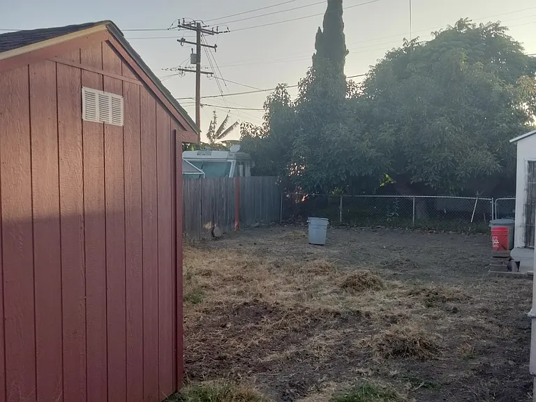 Large red shed that is currently unavailable but will be once the owner has emptied it out.