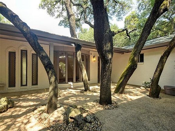 Courtyard entry with even more large trees