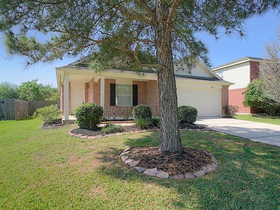 Nicely landscaped yard with shade trees