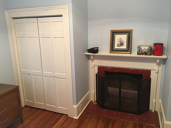 Guest bedroom closet and fireplace