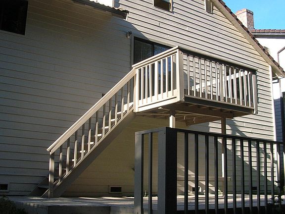 Back of house with two decks.