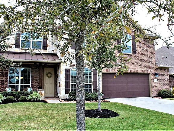 Upscale stone and brick exterior with beautiful energy efficient windows.