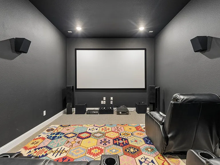 Fully equipped media room for your enjoyment, with 4 theatre recliners! Includes an Epsom projector, 120" screen and KEF 7.1 audio.