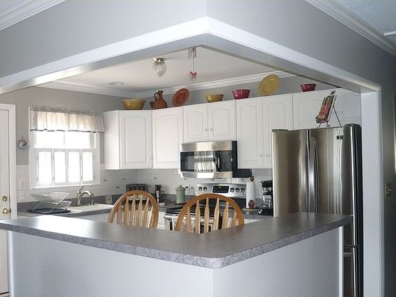 Updated Kitchen w/Breakfast Bar Overlooks Living Rm/Dining Rm