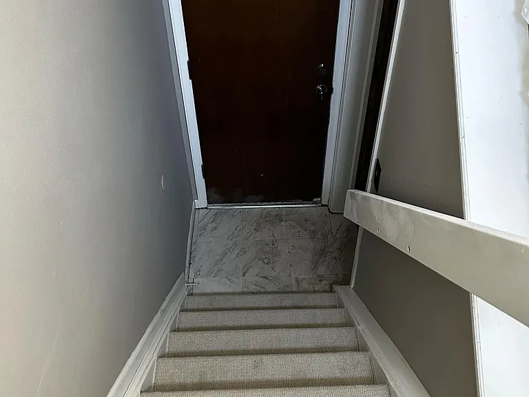 Stairs (down) to garage and HVAC